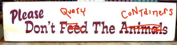 Please don't feed the animals hand-painted sign, scribbled over to say: please don't query the containers